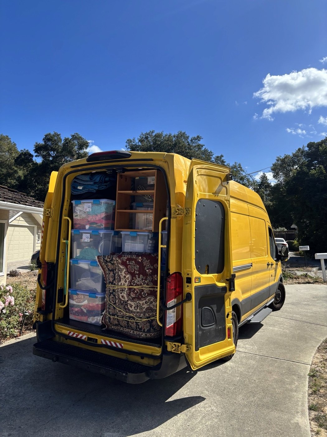 Furniture and bins loaded in a moving vehicle on an EasyWay project.